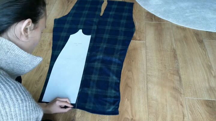 how to make a suspender skirt out of men s pajama pants, Placing the paper pattern on the fabric