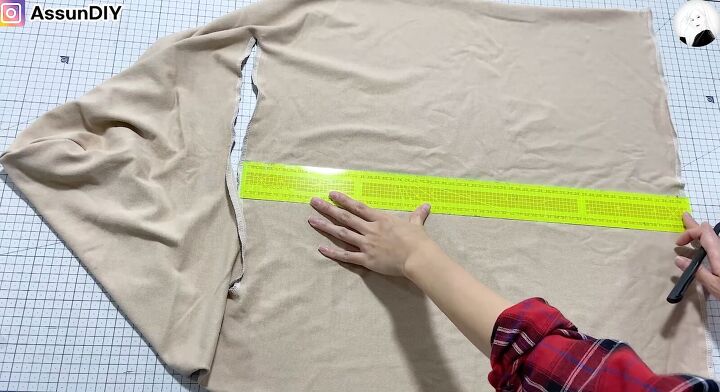 need a cool layering piece this winter try this diy hooded vest, Measuring down the fabric