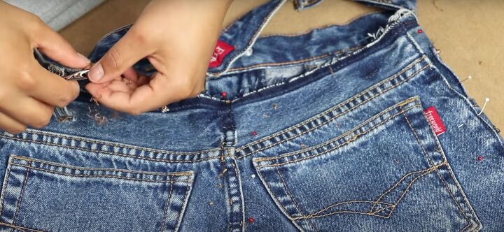 how to take in jeans the proper way for a perfect fit, Taking out the top seam stitches