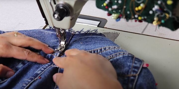 how to take in jeans the proper way for a perfect fit, Taking in the jeans by sewing