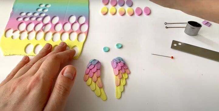how to make polymer clay wing earrings in angelic rainbow colors, Adding the top layer of feathers