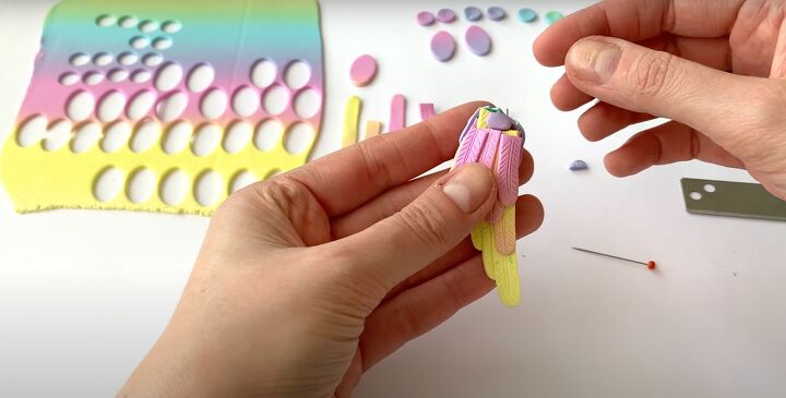 how to make polymer clay wing earrings in angelic rainbow colors, Inserting the eye pin
