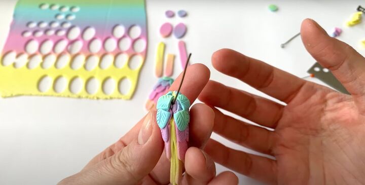 how to make polymer clay wing earrings in angelic rainbow colors, Covering the top of the wing with feathers