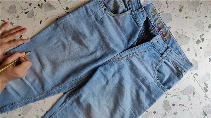 how to make cut off jean shorts skirts super easy tutorial, Marking the jeans at the new length