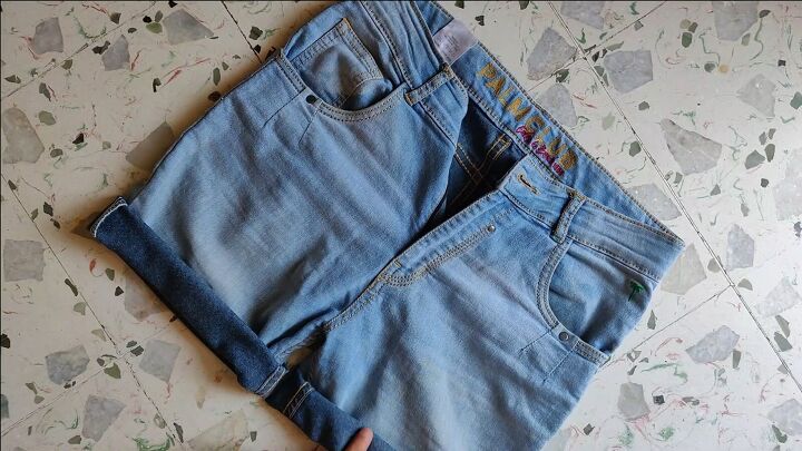 how to make cut off jean shorts skirts super easy tutorial, Rolling up the jeans for the cuffed look