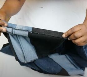 old jeans need an upcycle try this cute patchwork denim top diy, Hemming the bottom of the DIY denim top