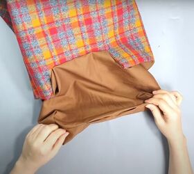 how to sew a cute plaid purse perfect for fall and winter, Tucking the lining into the bag