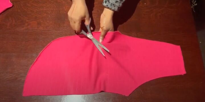 how to easily sew a flattering twist front top or sweater, Snipping a hole for the twist