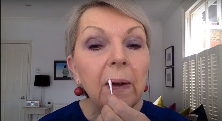 mature lips masterclass tips on applying lipstick for older women, Removing primer residue with a cotton swab