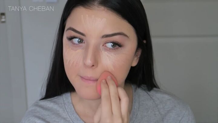 how to hide under eye dark circles with makeup in 3 simple steps, Blending the concealer with a beauty blender