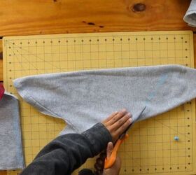 2 easy diy sweatshirt refashions making bandana flannel sleeves, Cutting off the sleeve at an angle