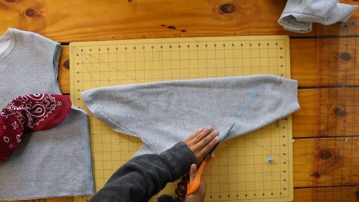 2 easy diy sweatshirt refashions making bandana flannel sleeves, Cutting off the sleeve at an angle