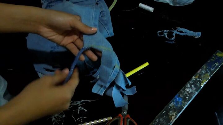 2 fun ways to refashion clothes diy cold shoulder top fringe jeans, Twisting the fringe