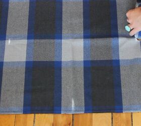 how to make a cute long vest out of an old blanket in 4 easy steps, Cutting out the armholes from the blanket