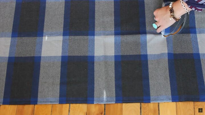 how to make a cute long vest out of an old blanket in 4 easy steps, Cutting out the armholes from the blanket