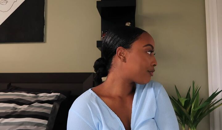 how to do a simple sleek low ponytail with a weave on natural hair, Tying hair in a twist at the back