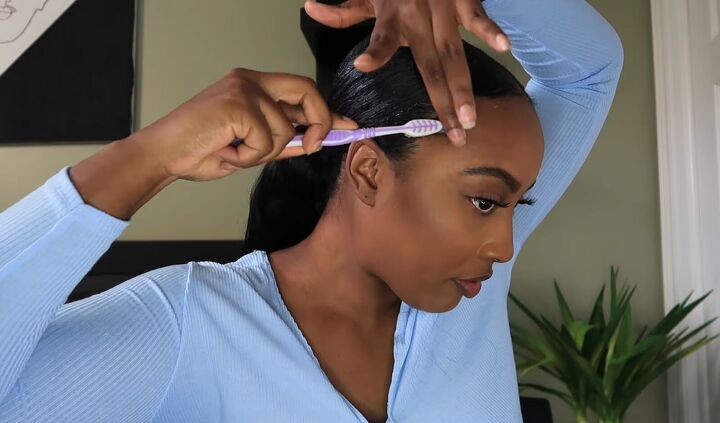 how to do a simple sleek low ponytail with a weave on natural hair, Laying down the edges with a toothbrush