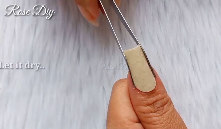 how to make strong fake nails out of masking tape nail glue, Squeezing the masking tape nail with tweezers