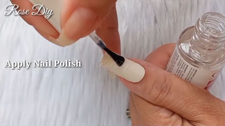 how to make strong fake nails out of masking tape nail glue, Applying clear nail polish on top of nails