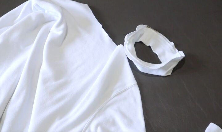 how to make a fun diy t shirt dress out of 4 thrifted men s t shirts, Removing the collar from the white t shirt