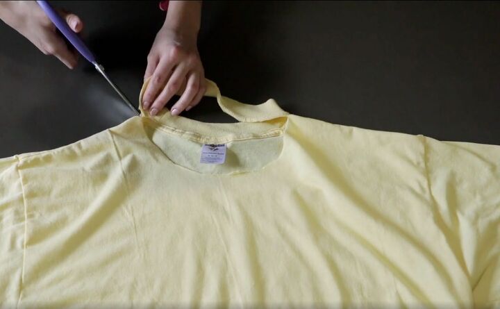 how to make a fun diy t shirt dress out of 4 thrifted men s t shirts, Cutting the collar off the yellow t shirt