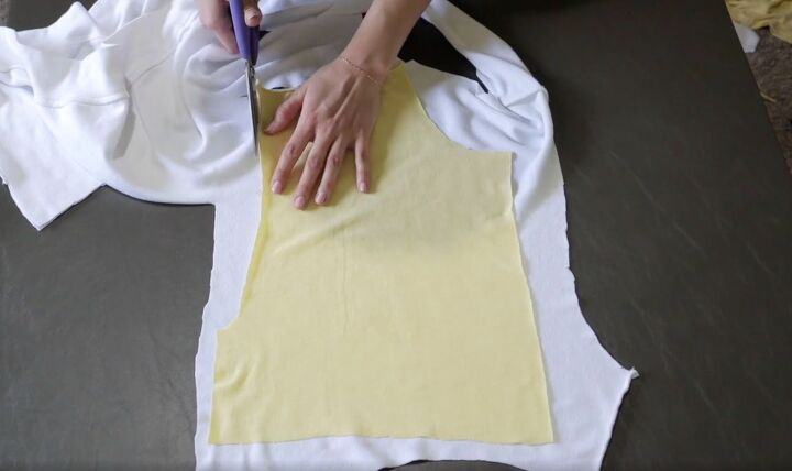 how to make a fun diy t shirt dress out of 4 thrifted men s t shirts, Tracing the pattern of the yellow bodice