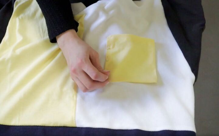how to make a fun diy t shirt dress out of 4 thrifted men s t shirts, Sewing the pocket to the t shirt dress