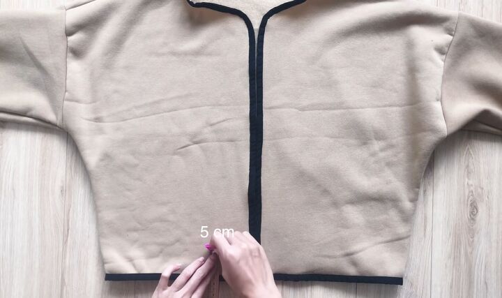 how to make a diy chanel inspired suit out of a long hoodie, Marking the pocket placement