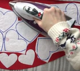 how to make a cute diy valentine s day outfit for you your dog, Ironing the adhesive onto red fabric