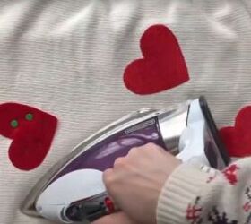 how to make a cute diy valentine s day outfit for you your dog, Ironing the Valentine hearts to the sweater