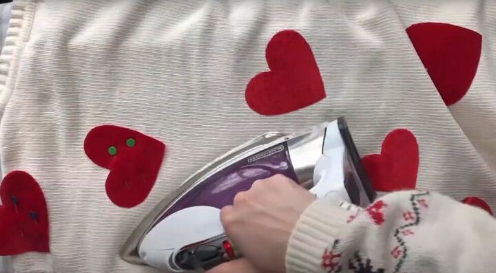how to make a cute diy valentine s day outfit for you your dog, Ironing the Valentine hearts to the sweater