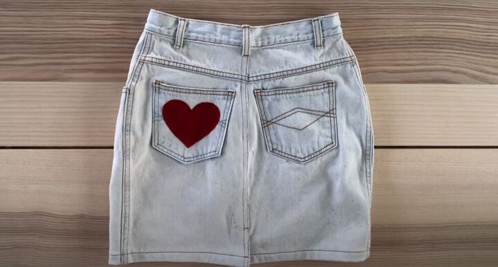 how to make a cute diy valentine s day outfit for you your dog, Attaching a heart to the denim skirt pocket