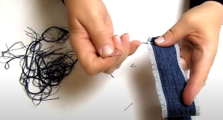 how to make cute diy denim bracelets cuffs out of old jeans, Pulling denim threads to get frayed edges