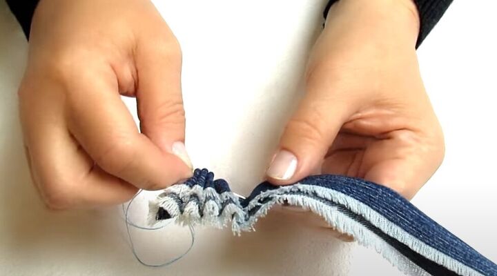 how to make cute diy denim bracelets cuffs out of old jeans, Creating little ruffled folds in the denim