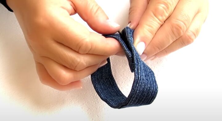 how to make cute diy denim bracelets cuffs out of old jeans, Sewing Velco to the ends of the denim cuff