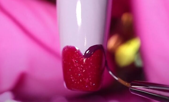 how to do adorable red purple and pink valentine s day nails, Outlining the heart in deep purple