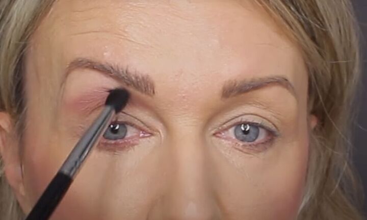 get ready for romance with this glam valentine s day makeup tutorial, Applying pinky brown eyeshadow above the lids