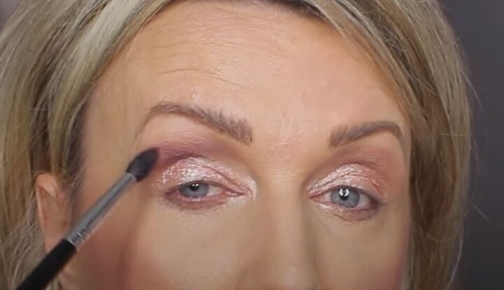 get ready for romance with this glam valentine s day makeup tutorial, Applying bronze eyeshadow to the outer corner