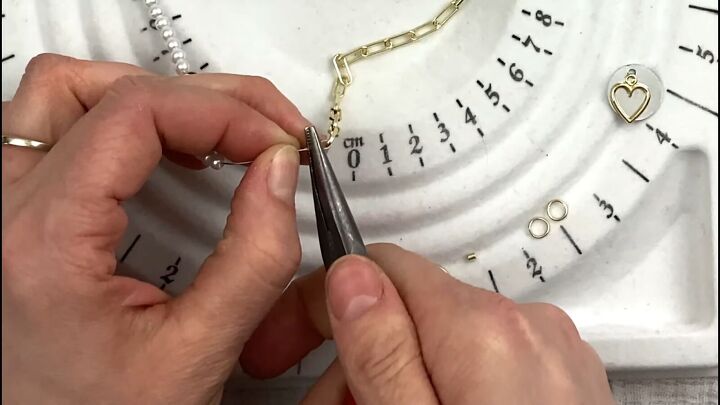 how to make a cute half pearl half chain necklace in 6 simple steps, Crimping the crimping bead with pliers