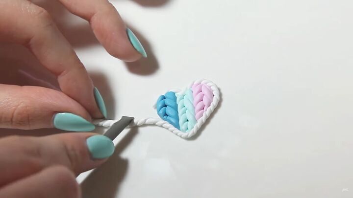 how to make a cute polymer clay heart pendant for valentine s day, Cutting the excess polymer clay