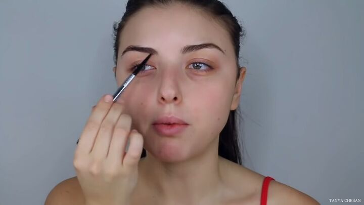 how to do effortlessly sexy red valentine s day makeup, Filling in eyebrows with a brow pencil