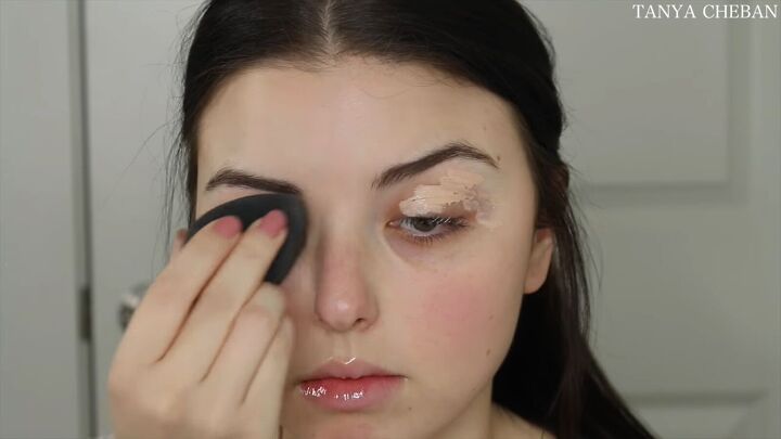 how to do simple valentines day makeup for a soft feminine vibe, Applying and blending primer with a sponge