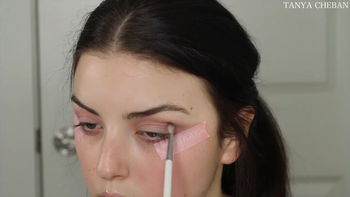 how to do simple valentines day makeup for a soft feminine vibe, Defining the crease with a berry color
