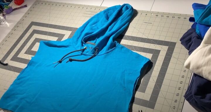 how to easily make your own color block hoodie with patchwork pieces, Cutting the sleeves pockets and waistband