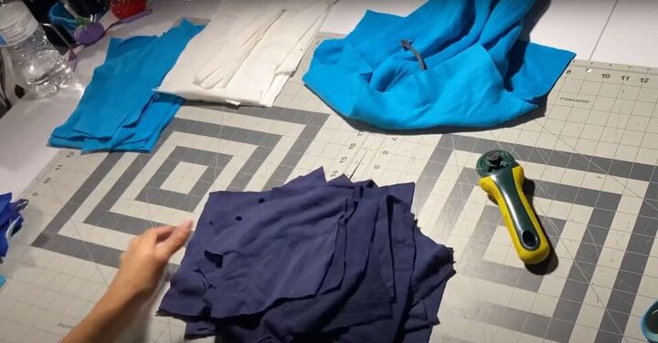 how to easily make your own color block hoodie with patchwork pieces, Cutting up patchwork pieces from the hoodies