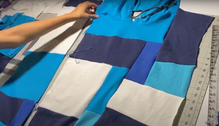 how to easily make your own color block hoodie with patchwork pieces, Sewing the sides of the hoodie