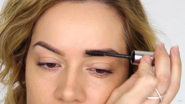 how to create a cool pink eye lip makeup look for valentines day, Applying brow gel to keep eyebrows in place