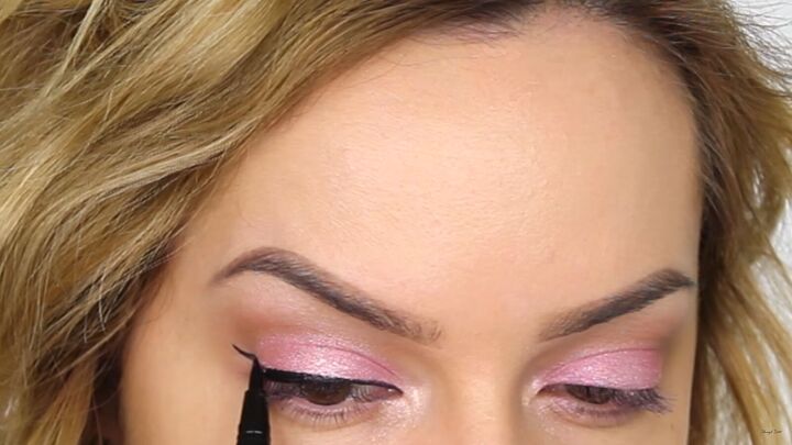 how to create a cool pink eye lip makeup look for valentines day, Drawing a wing on the upper lash line