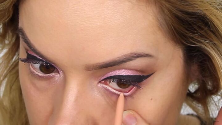 how to create a cool pink eye lip makeup look for valentines day, Applying nude eyeliner to the waterline