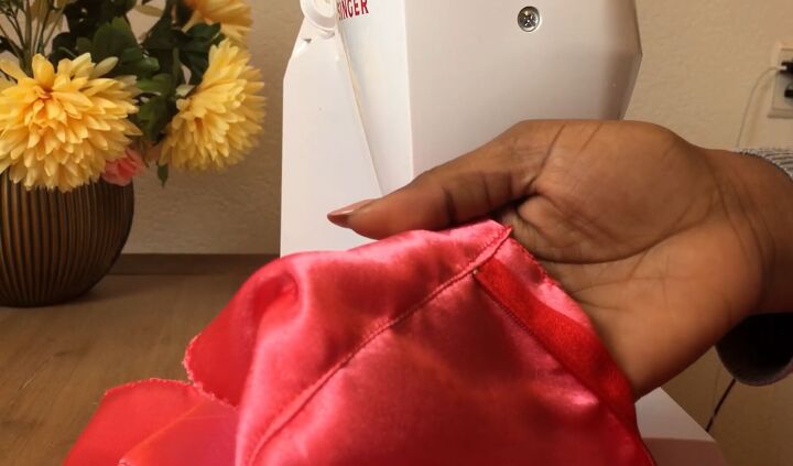 how to make a simple diy drawstring skirt step by step tutorial, Sewing the facing to the skirt